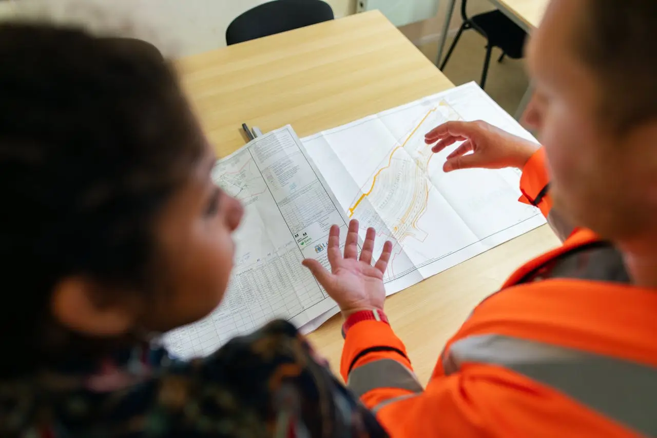 Quantity Surveyors Tauranga engaging in client discussion to provide expert cost estimation and project insights for New Builds, QS Bank Reports, Labour Only Costings and Commercial Quantity Surveying.